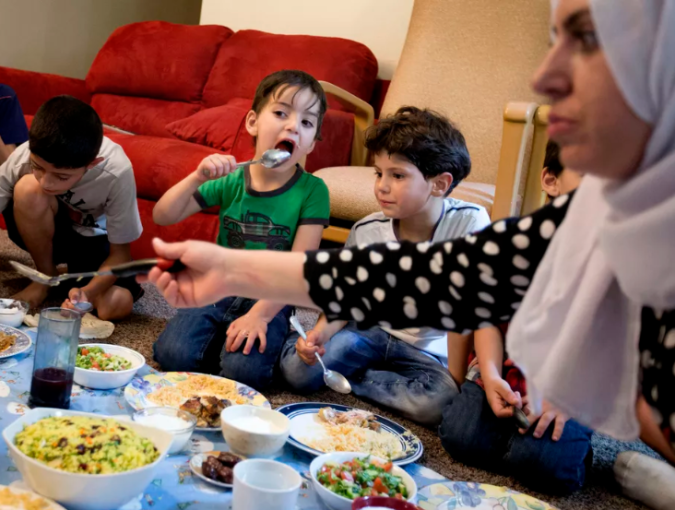 Rasha Hredeen, right, and her children and nephews eat iftar during the month of Ramadan at the Hredeen home in Millcreek on Tuesday, June 6, 2017. Laura Seitz, Deseret News